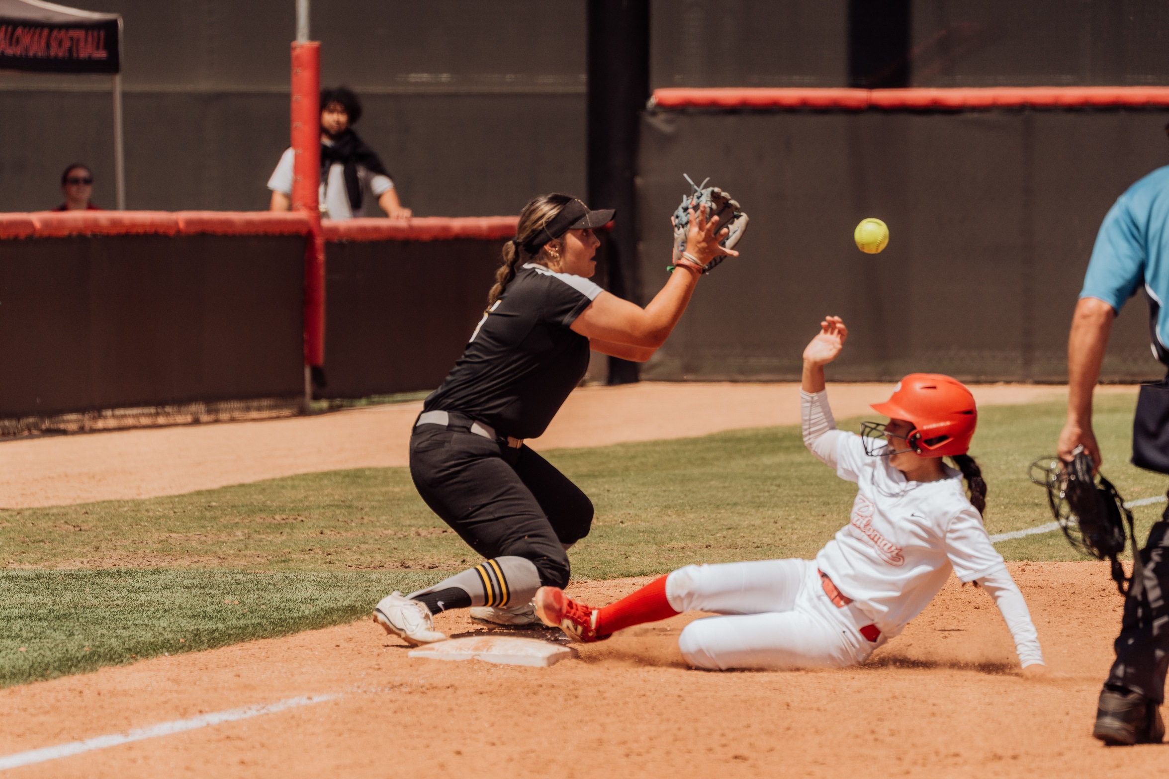 Nalia Nuanez slides into third base. Photo by Hector Flores.